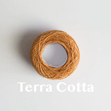 Load image into Gallery viewer, A &#39;Terra Cotta&#39; colour yarn cake of 2/16s mercerised cotton yarn