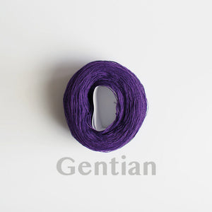 A 'Gentian' colour yarn cake of 2/16s mercerised cotton yarn