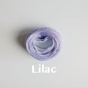 A 'Lilac' colour yarn cake of 2/16s mercerised cotton yarn