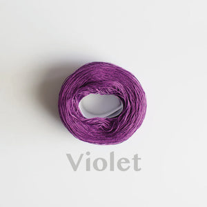 A 'Violet' colour yarn cake of 2/16s mercerised cotton yarn