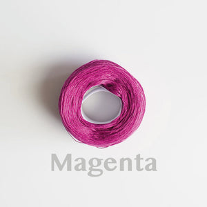A 'Magenta' colour yarn cake of 2/16s mercerised cotton yarn