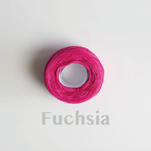 A 'Fuchsia' colour yarn cake of 2/16s mercerised cotton yarn