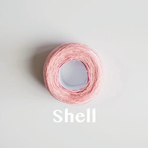 A 'Shell' colour yarn cake of 2/16s mercerised cotton yarn