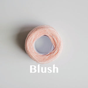 A 'Blush' colour yarn cake of 2/16s mercerised cotton yarn