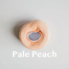 Load image into Gallery viewer, A &#39;Pale Peach&#39; colour yarn cake of 2/16s mercerised cotton yarn