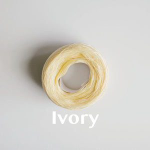 A 'Ivory' colour yarn cake of 2/16s mercerised cotton yarn