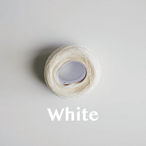 A 'White' colour yarn cake of 2/16s mercerised cotton yarn