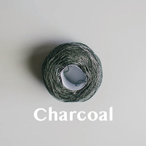 A 'Charcoal' colour yarn cake of 2/16s mercerised cotton yarn