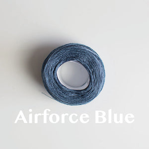 An 'Airforce Blue' colour yarn cake of 2/16s mercerised cotton yarn
