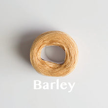 Load image into Gallery viewer, A &#39;Barley&#39; colour yarn cake of 2/16s mercerised cotton yarn