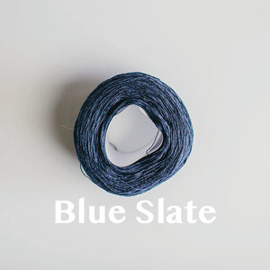 A 'Blue Slate' colour yarn cake of 2/16s mercerised cotton yarn