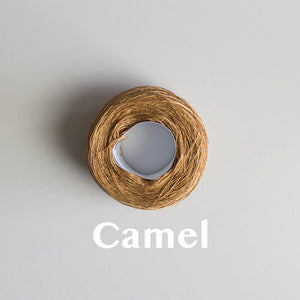 A 'Camel' colour yarn cake of 2/16s mercerised cotton yarn