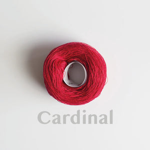 A 'Cardinal' colour yarn cake of 2/16s mercerised cotton yarn