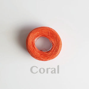 A 'Coral' colour yarn cake of 2/16s mercerised cotton yarn