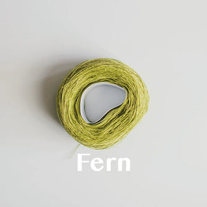A 'Fern' colour yarn cake of 2/16s mercerised cotton yarn