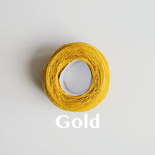 Load image into Gallery viewer, A &#39;Gold&#39; colour yarn cake of 2/16s mercerised cotton yarn