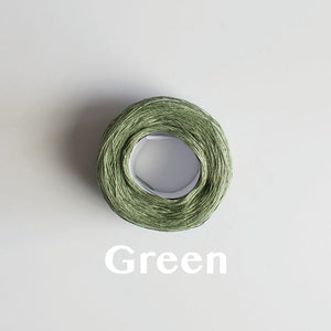 A 'Green' colour yarn cake of 2/16s mercerised cotton yarn