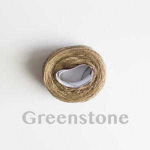 A 'Greenstone' colour yarn cake of 2/16s mercerised cotton yarn