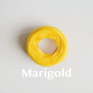 A 'Marigold' colour yarn cake of 2/16s mercerised cotton yarn