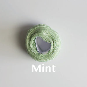 A 'Mint' colour yarn cake of 2/16s mercerised cotton yarn
