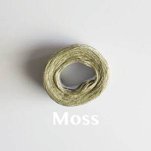 A 'Moss' colour yarn cake of 2/16s mercerised cotton yarn