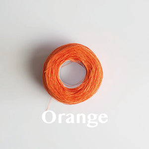A 'Orange' colour yarn cake of 2/16s mercerised cotton yarn