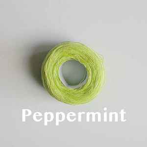 A 'Peppermint' colour yarn cake of 2/16s mercerised cotton yarn