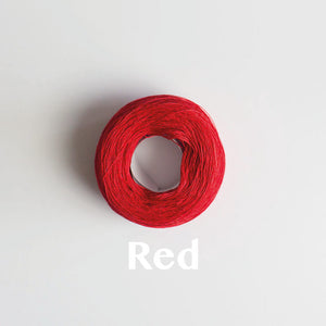 A 'Red' colour yarn cake of 2/16s mercerised cotton yarn