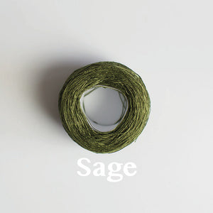 A 'Sage' colour yarn cake of 2/16s mercerised cotton yarn