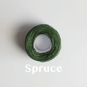 A 'Spruce' colour yarn cake of 2/16s mercerised cotton yarn