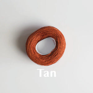 A 'Tan' colour yarn cake of 2/16s mercerised cotton yarn