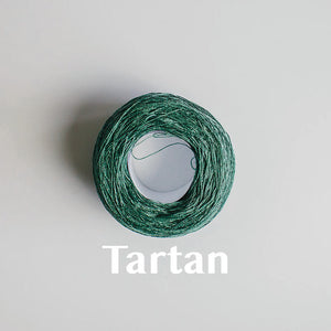 A 'Tartan' colour yarn cake of 2/16s mercerised cotton yarn
