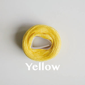 A 'Yellow' colour yarn cake of 2/16s mercerised cotton yarn