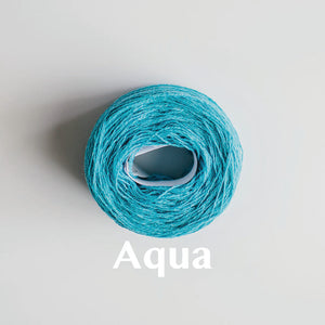 A 'Aqua' colour yarn cake of 2/17s merino lambswool yarn