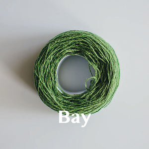 A 'Bay' colour yarn cake of 2/17s merino lambswool yarn