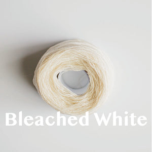 A 'Bleached White' colour yarn cake of 2/17s merino lambswool yarn