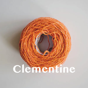 A 'Clementine' colour yarn cake of 2/17s merino lambswool yarn