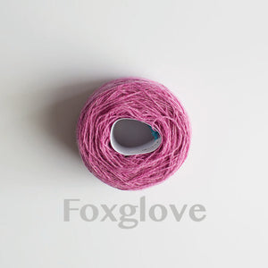 A 'Foxglove' colour yarn cake of 2/17s merino lambswool yarn