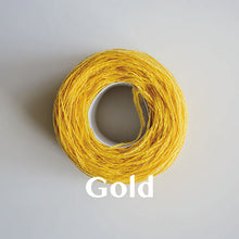 Load image into Gallery viewer, A &#39;Gold&#39; colour yarn cake of 2/17s merino lambswool yarn
