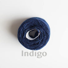 Load image into Gallery viewer, An &#39;Indigo&#39; colour yarn cake of 2/17s merino lambswool yarn
