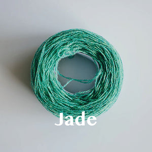 A 'Jade' colour yarn cake of 2/17s merino lambswool yarn