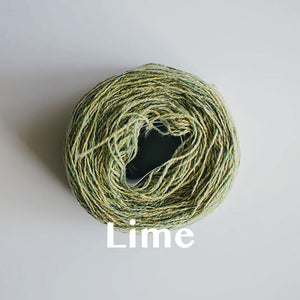 A 'Lime' colour yarn cake of 2/17s merino lambswool yarn