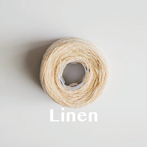 A 'Linen' colour yarn cake of 2/17s merino lambswool yarn