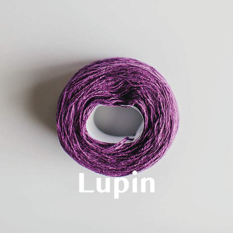 A 'Lupin' colour yarn cake of 2/17s merino lambswool yarn