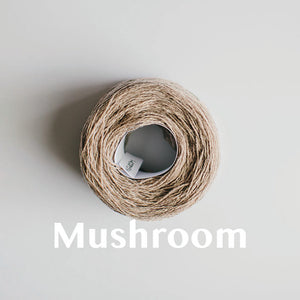 A 'Mushroom' colour yarn cake of 2/17s merino lambswool yarn