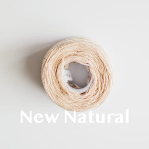 A 'New Natural' colour yarn cake of 2/17s merino lambswool yarn