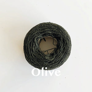 An 'Olive' colour yarn cake of 2/17s merino lambswool yarn