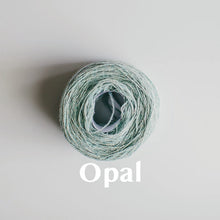 Load image into Gallery viewer, An &#39;Opal&#39; colour yarn cake of 2/17s merino lambswool yarn