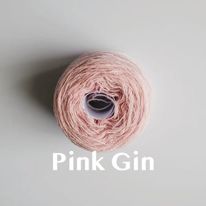 A 'Pink Gin' colour yarn cake of 2/17s merino lambswool yarn
