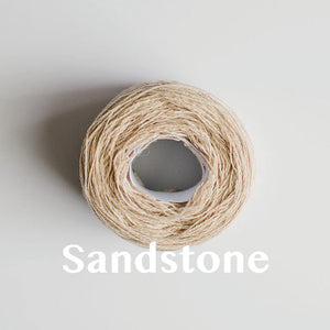 A 'Sandstone' colour yarn cake of 2/17s merino lambswool yarn